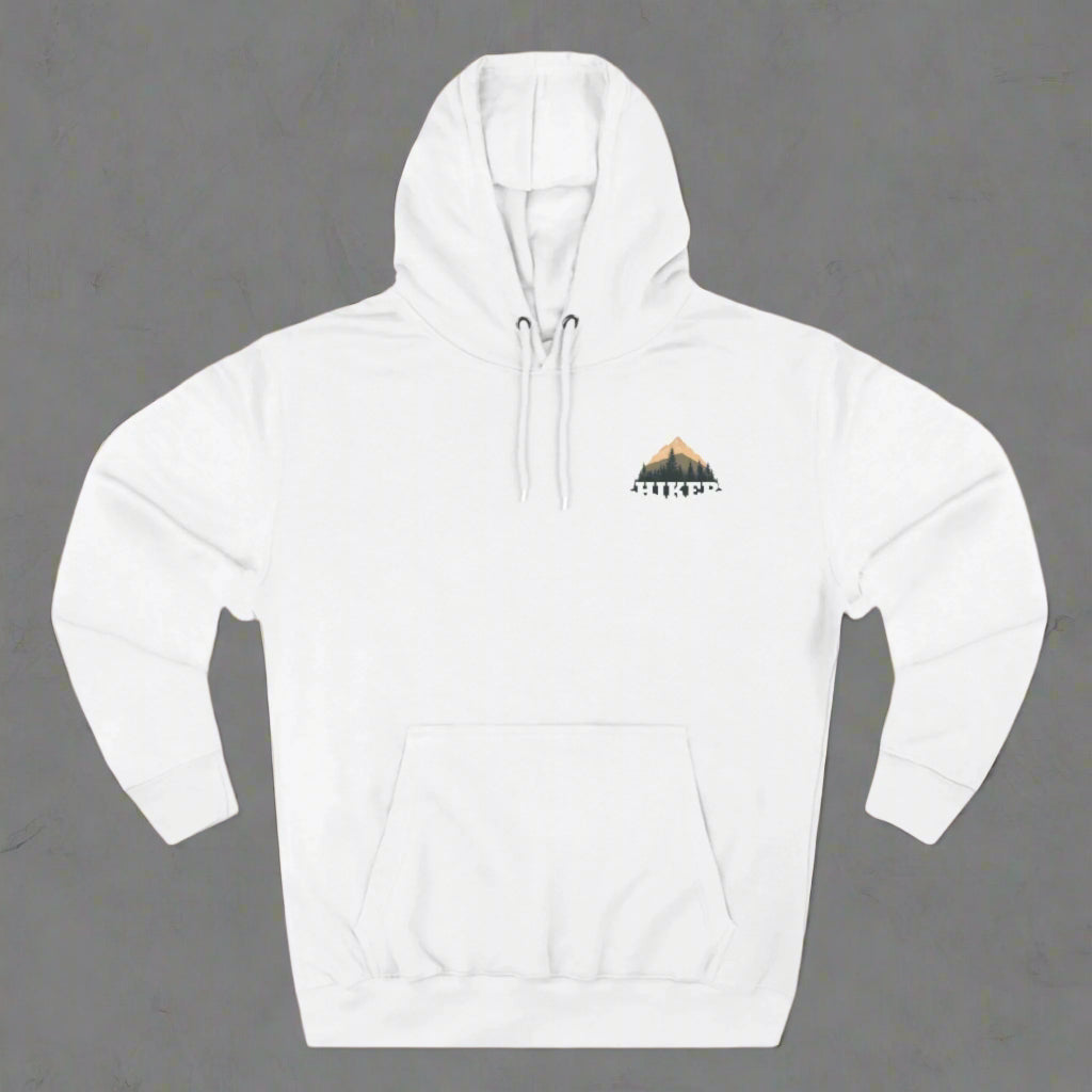 A person wearing a white fleece hoodie with a hood, featuring a small embroidery design on the chest.