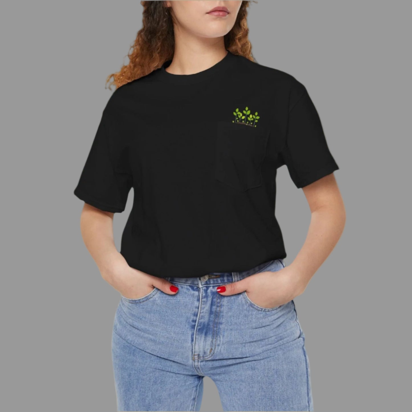 A person wearing a black crew neck t-shirt with a logo on the left chest pocket, paired with blue jeans.